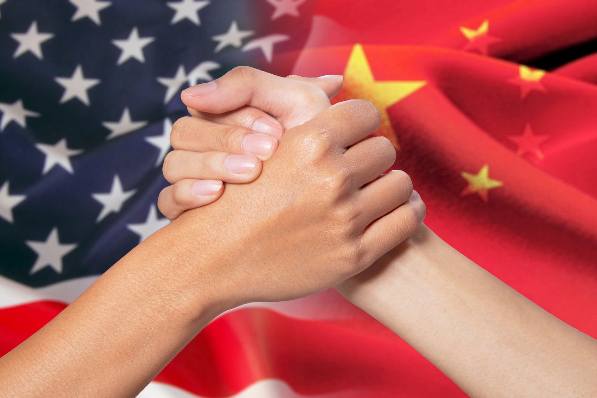Partnership hands with russian and american flags